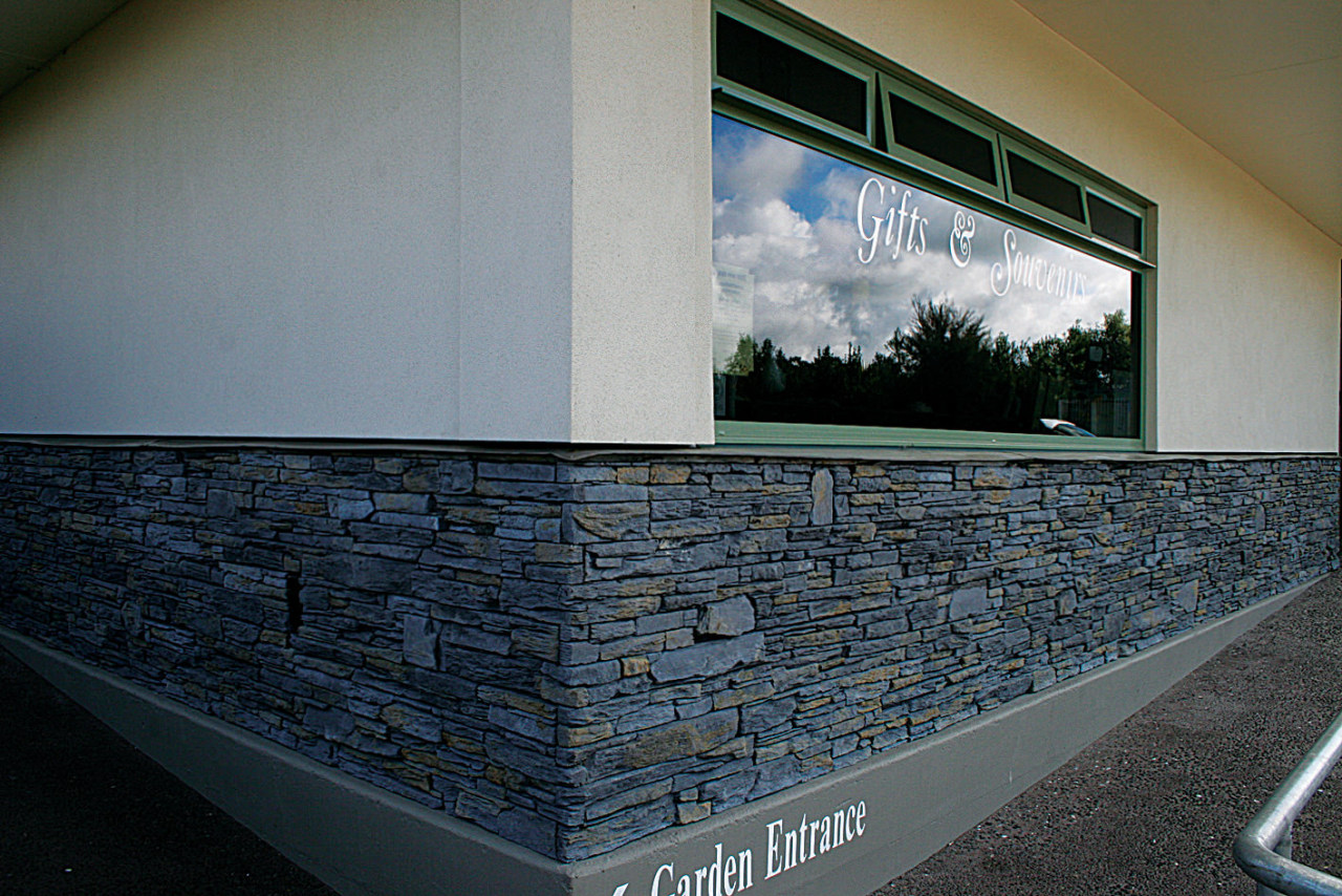 vie2w of this stone clad wall constructed by architecture, daylighting, glass, wall, window, gray, black