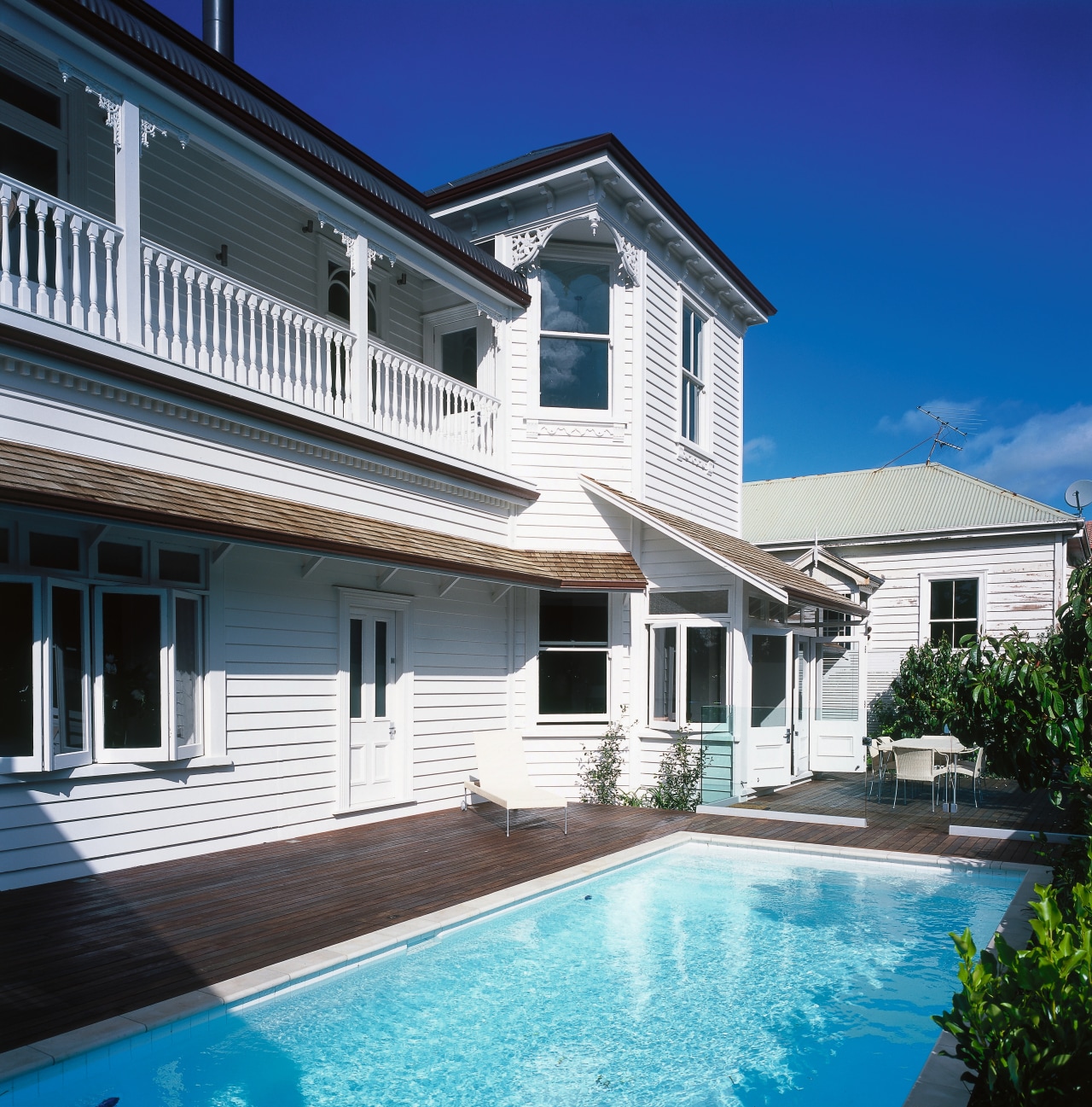 An exterior view of the pool and patio building, cottage, estate, facade, home, house, property, real estate, residential area, siding, swimming pool, villa, window