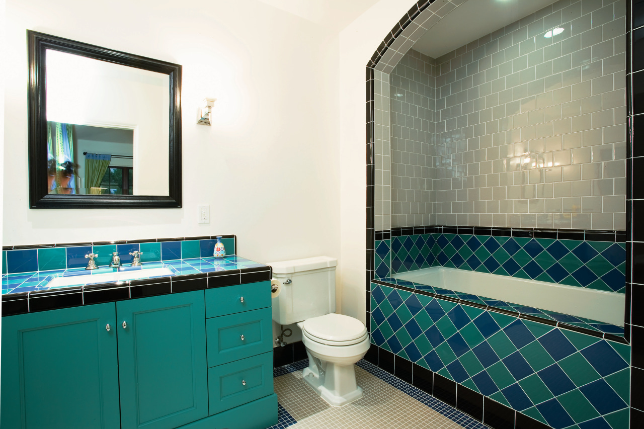 A second family bathroom repeats the theme of bathroom, blue, estate, floor, home, interior design, property, room, tile, window, white