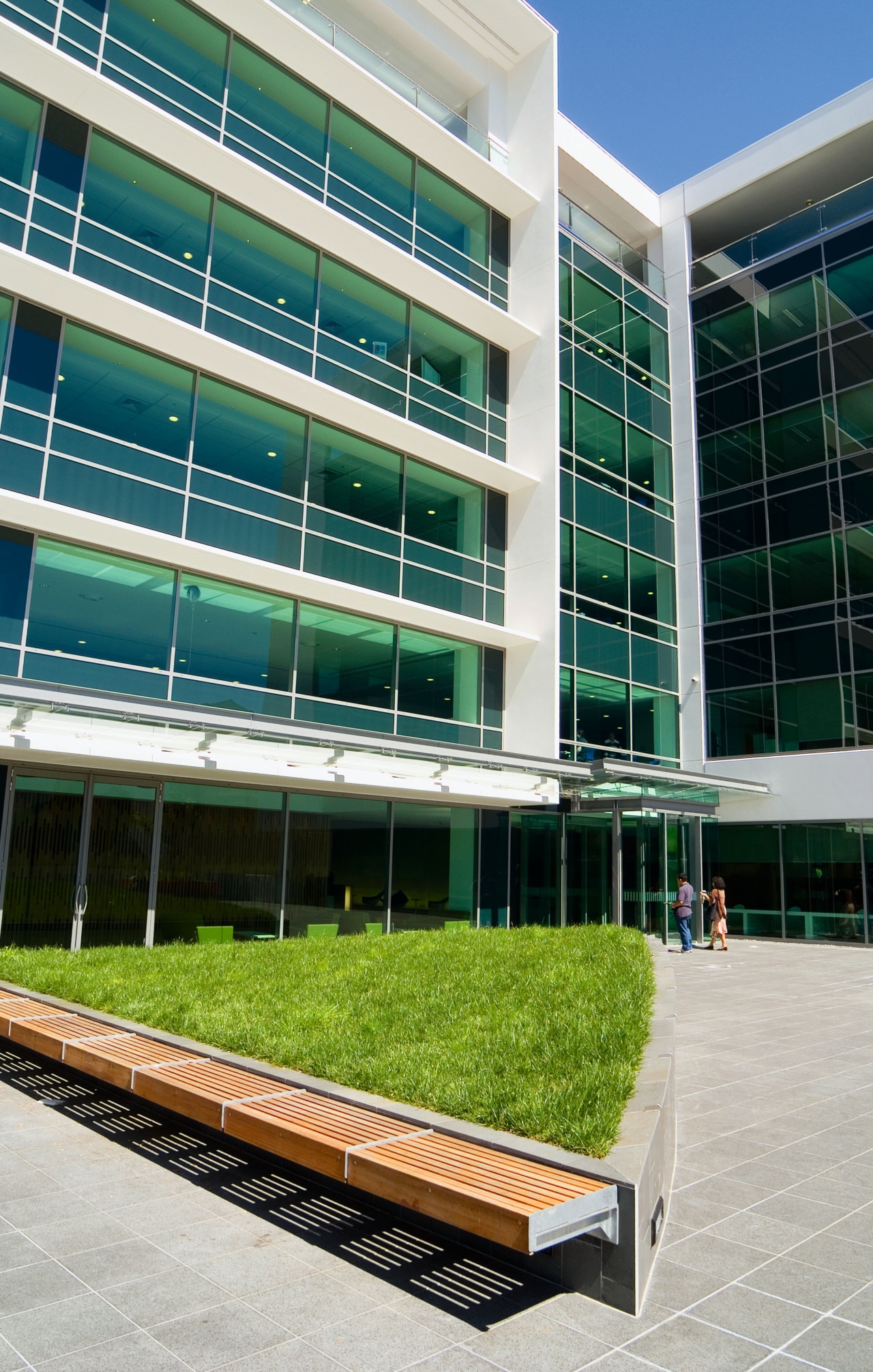 An exterior view of the AirNZ building. architecture, building, commercial building, condominium, corporate headquarters, facade, headquarters, mixed use, window, teal