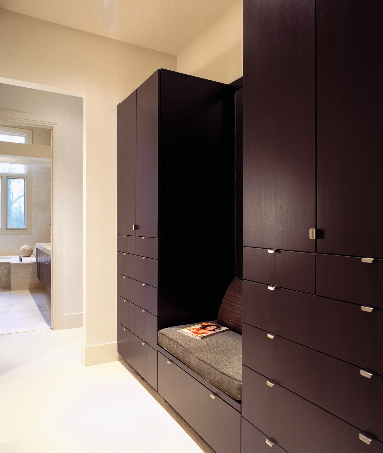 A view of the wooden cabinetry. cabinetry, furniture, interior design, room, wardrobe, black
