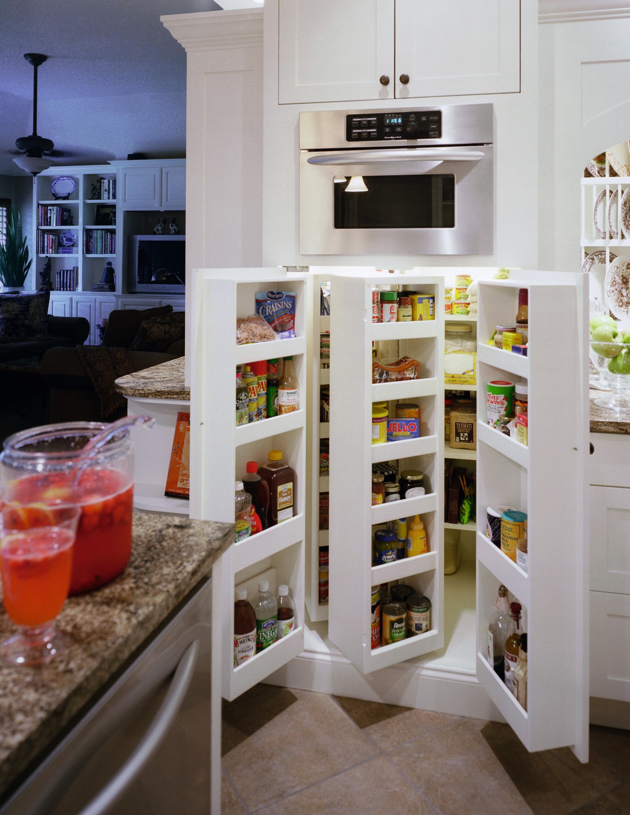 A close up view of the kitchen cabinetry. cabinetry, countertop, furniture, interior design, kitchen, pantry, refrigerator, shelf, shelving, gray