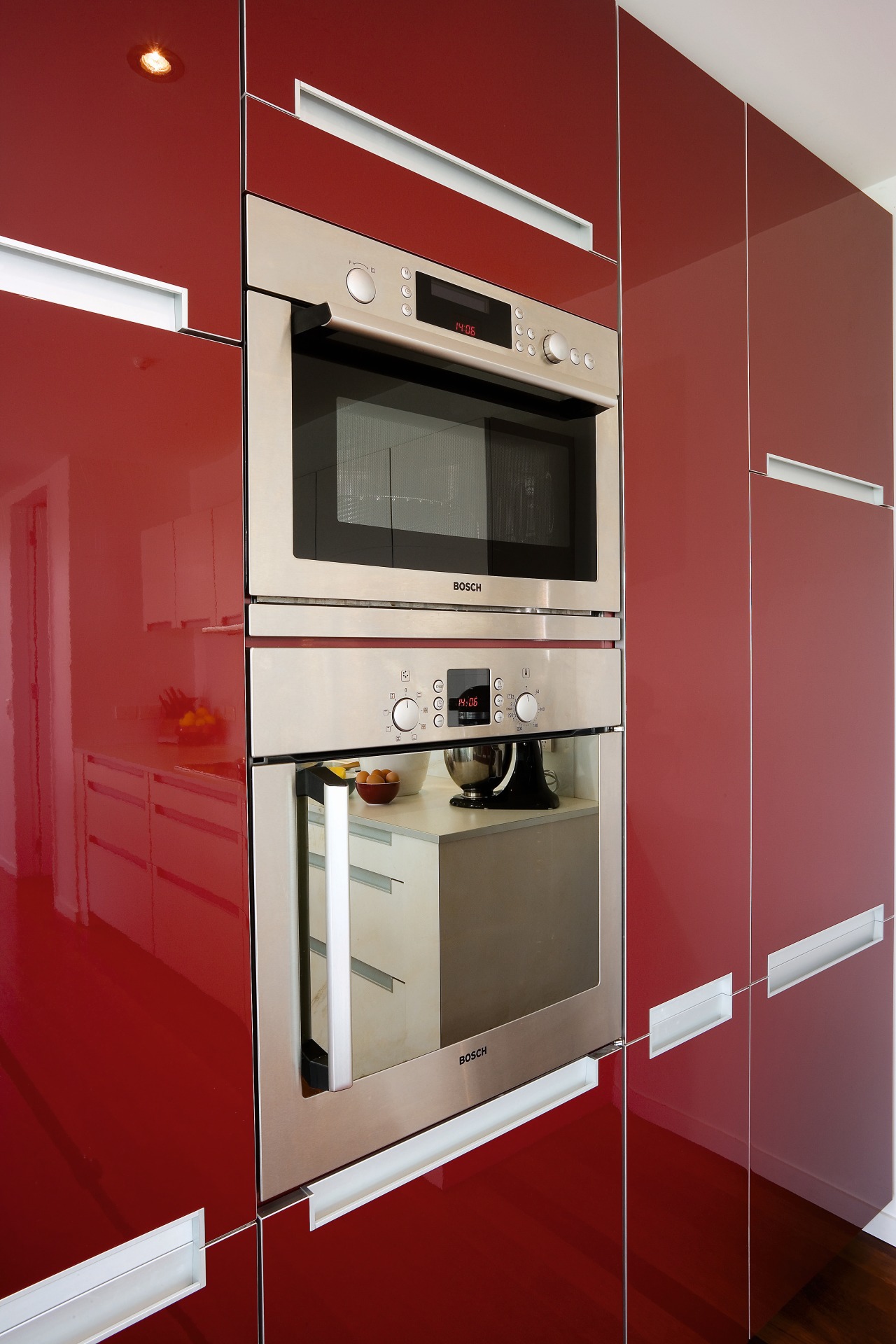 A close up view of the stainless steel cabinetry, countertop, home appliance, interior design, kitchen, kitchen stove, major appliance, product design, room, red