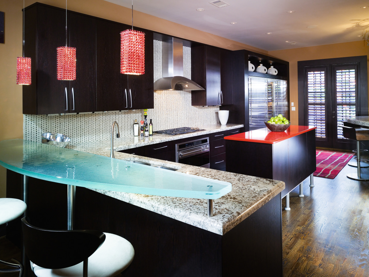 A view of this kitchen featuring black cabinetry, countertop, interior design, kitchen, room, table, black