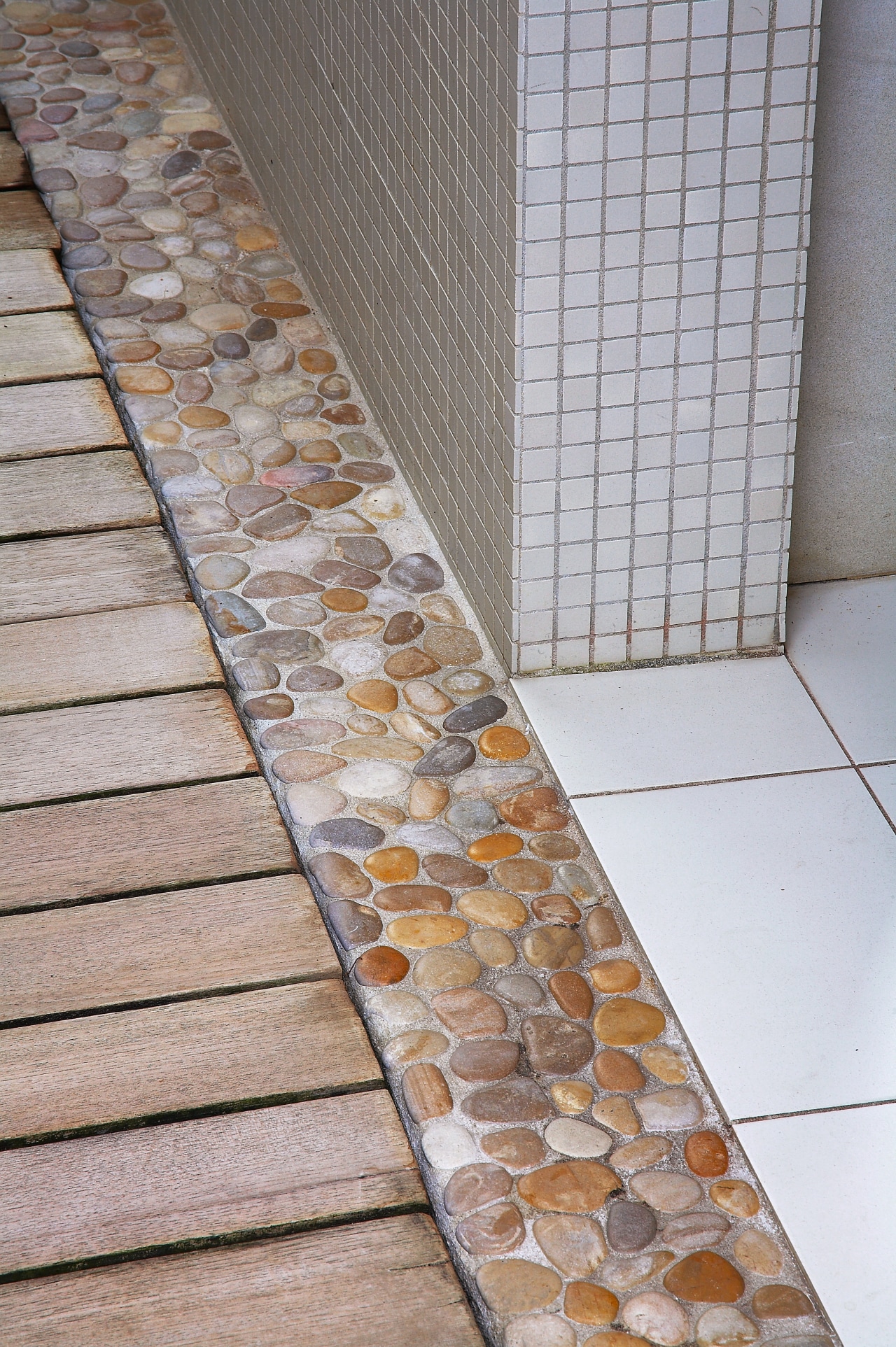 A view of the wood slate boardwalk and floor, flooring, tile, wall, gray