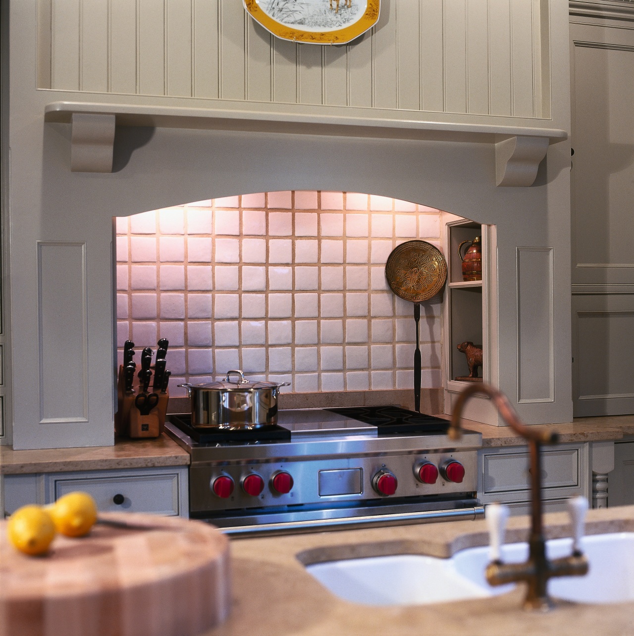 A view of this kitchen that features a countertop, floor, flooring, interior design, kitchen, room, gray