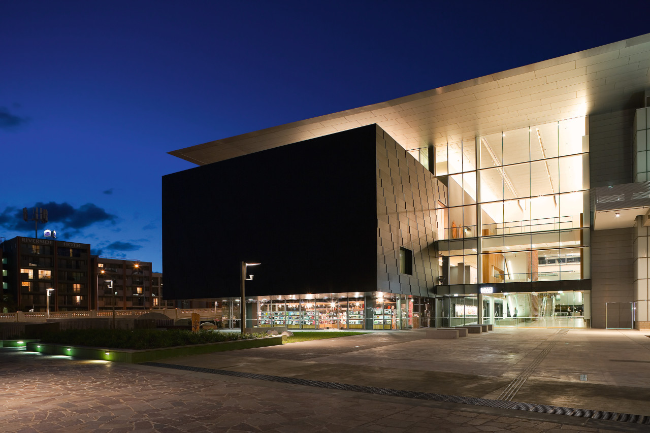 A view of the two buildings which form apartment, architecture, building, city, commercial building, condominium, corporate headquarters, evening, facade, headquarters, home, house, metropolitan area, mixed use, night, real estate, reflection, residential area, sky, black, blue