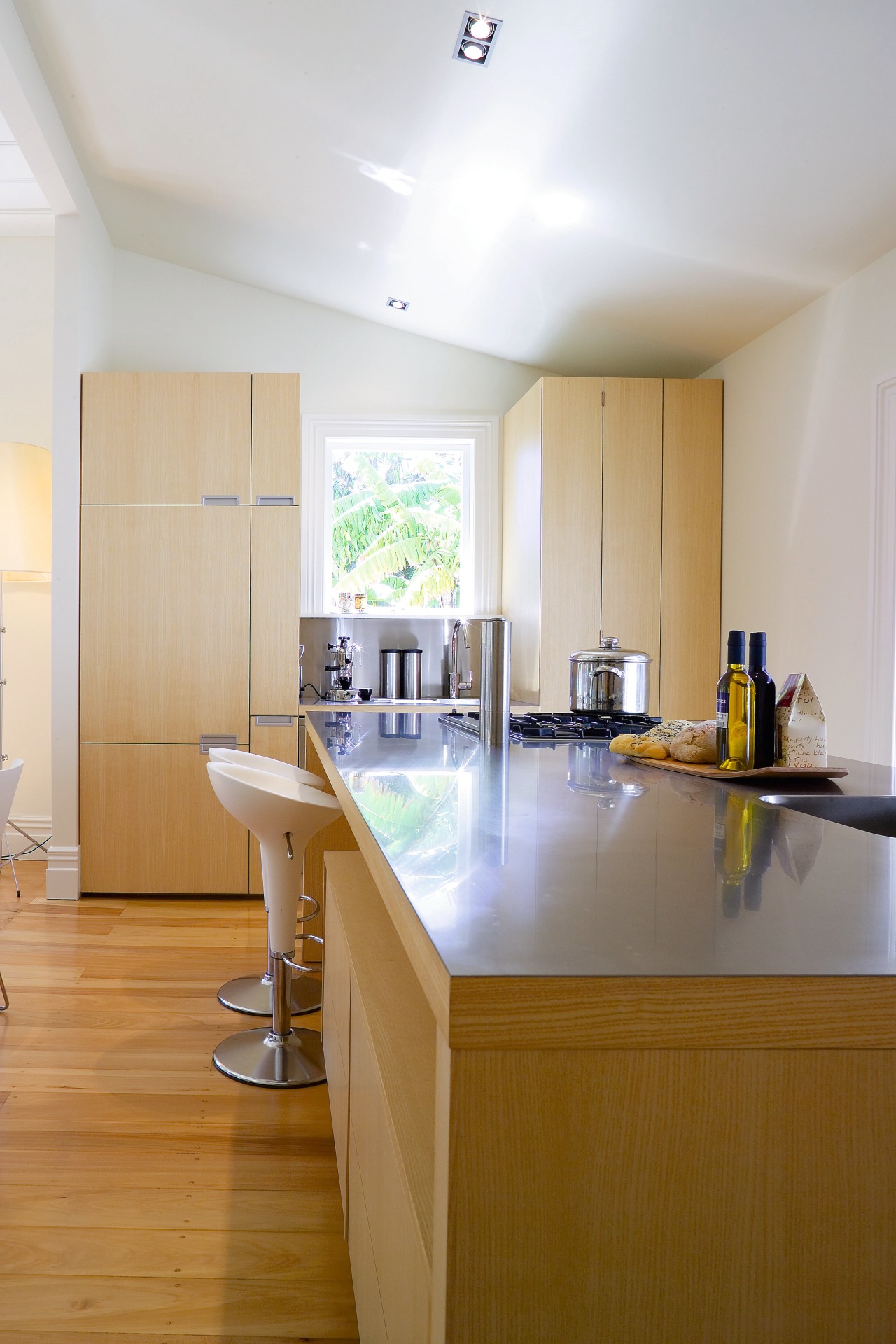 A view of the kitchen area, wooden flooring architecture, cabinetry, ceiling, countertop, daylighting, floor, flooring, home, house, interior design, kitchen, real estate, room, table, gray, brown, white