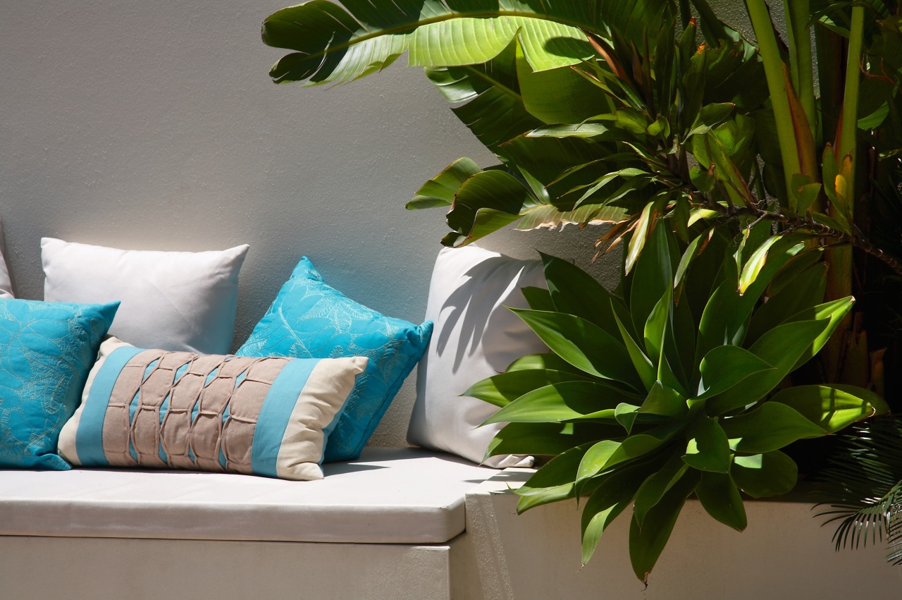 view of  the outdoor couch nestled against green, houseplant, interior design, leaf, plant, brown, gray