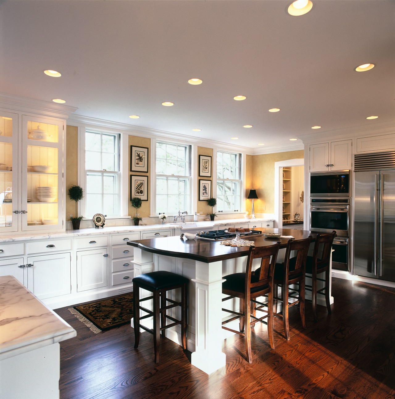 View of kitchen with white cabinetry and walnut cabinetry, ceiling, countertop, cuisine classique, floor, flooring, hardwood, interior design, kitchen, room, wood flooring, gray