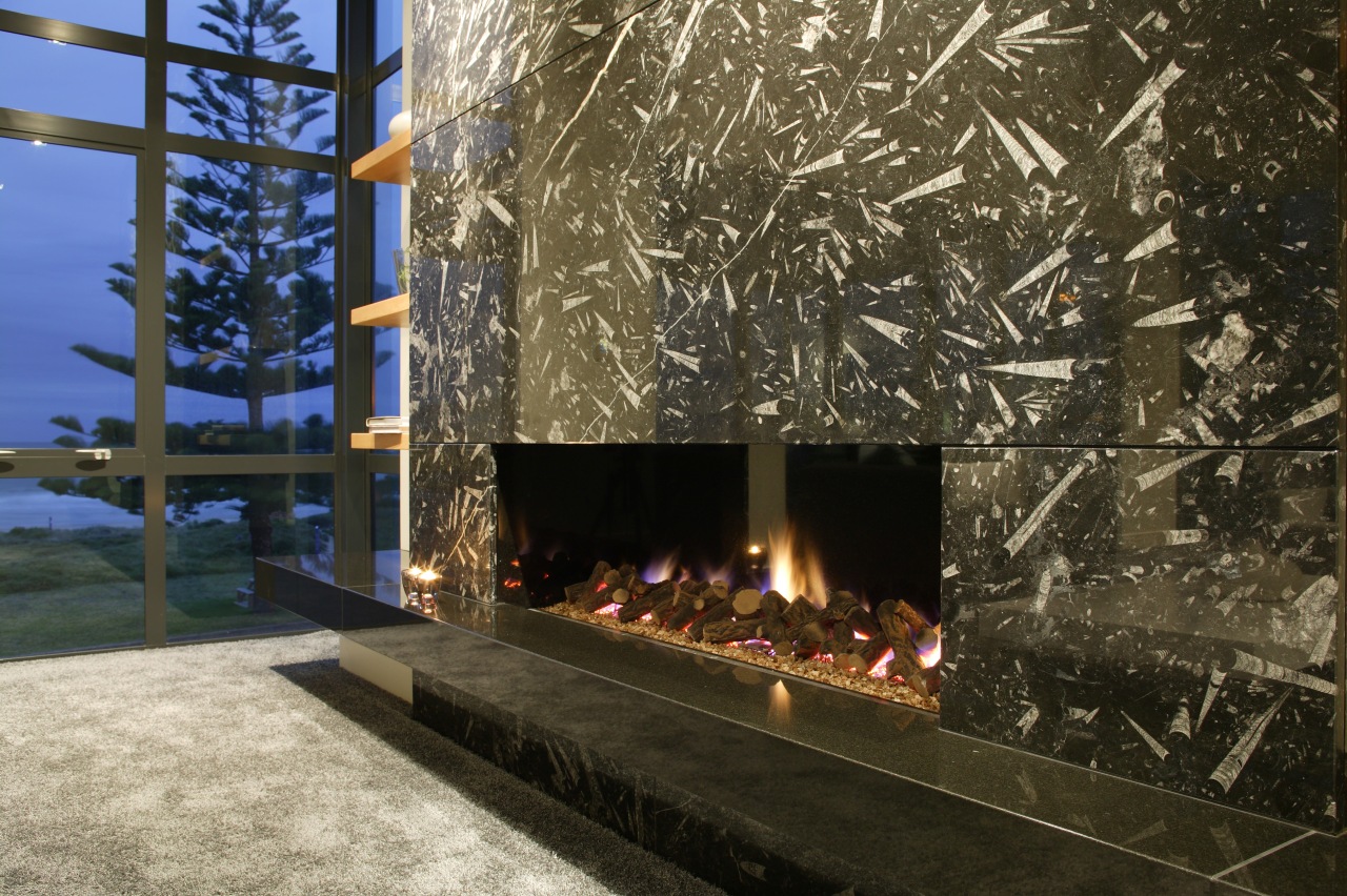 A view of a fireplace from Living Flame. hearth, home, tree, black