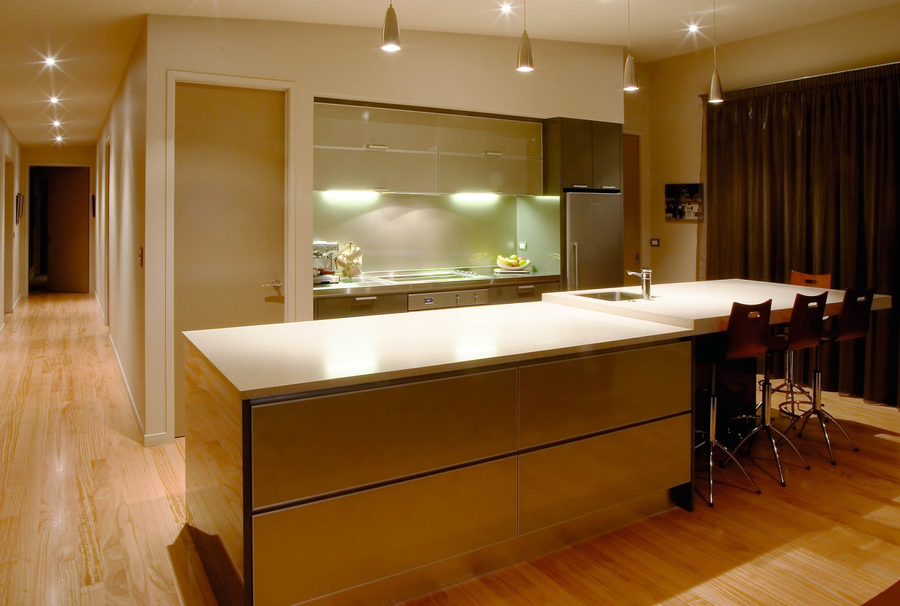 View of kitchen with light coloured countertop, and cabinetry, ceiling, countertop, floor, flooring, hardwood, interior design, kitchen, lighting, real estate, room, wood flooring, brown