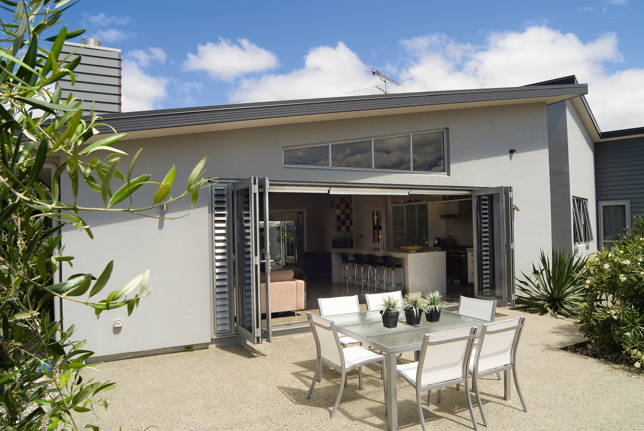 A view of a home by GJ Gadiner estate, home, house, outdoor structure, patio, property, real estate, villa, white