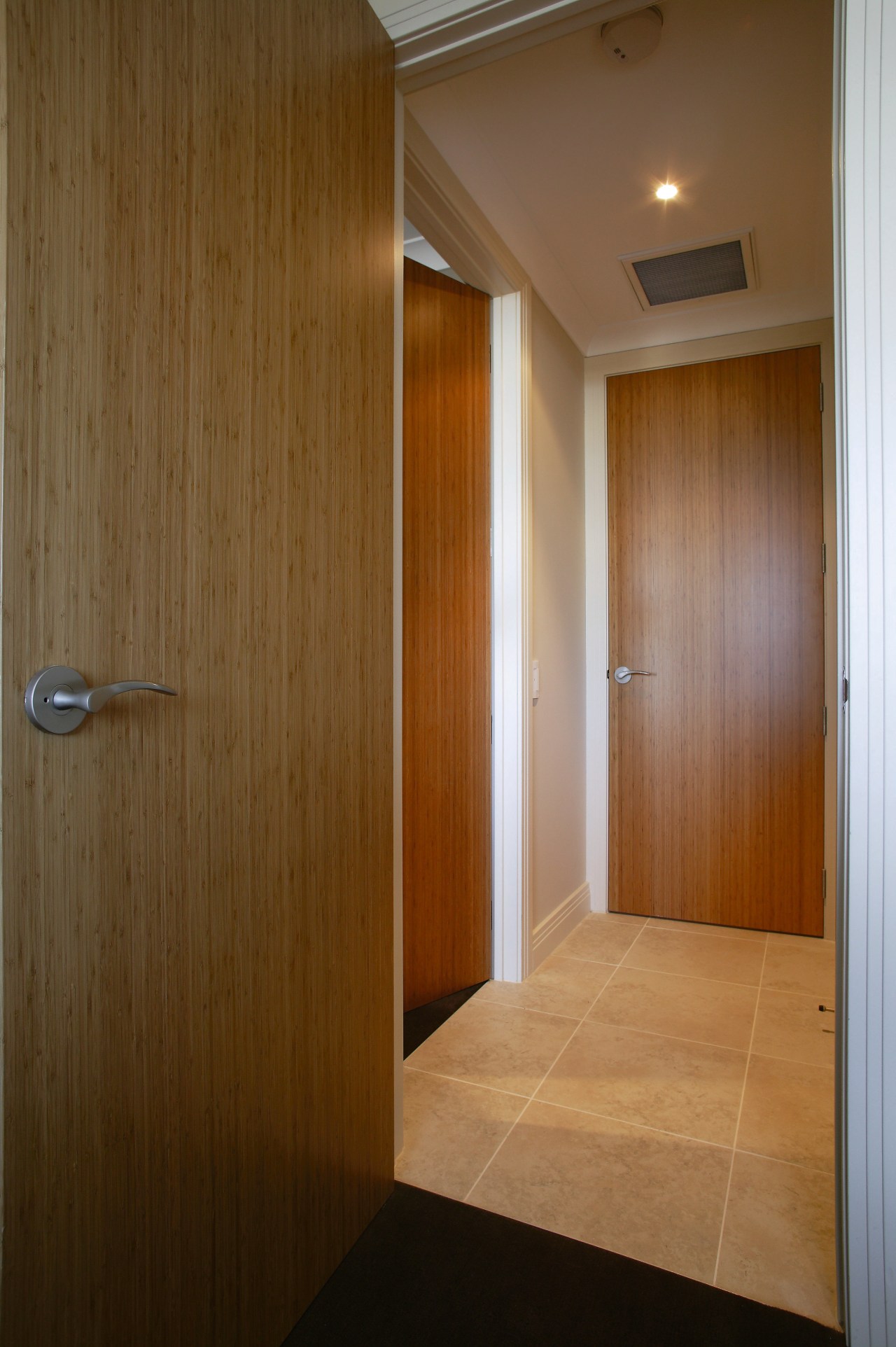 A view of the hallway and solid bamboo apartment, architecture, ceiling, door, floor, flooring, hardwood, interior design, lighting, real estate, wall, wood, wood stain, brown