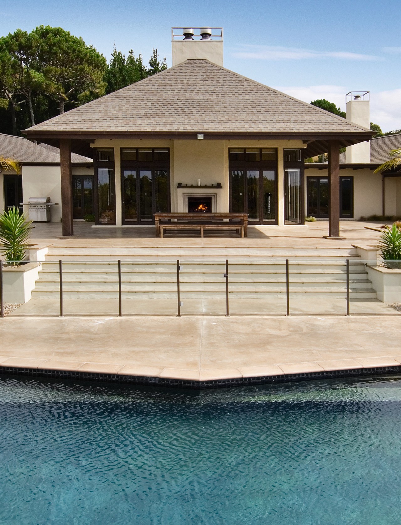 A vie wof some pavers by Peter Fell. deck, estate, facade, home, house, outdoor structure, swimming pool, villa, 