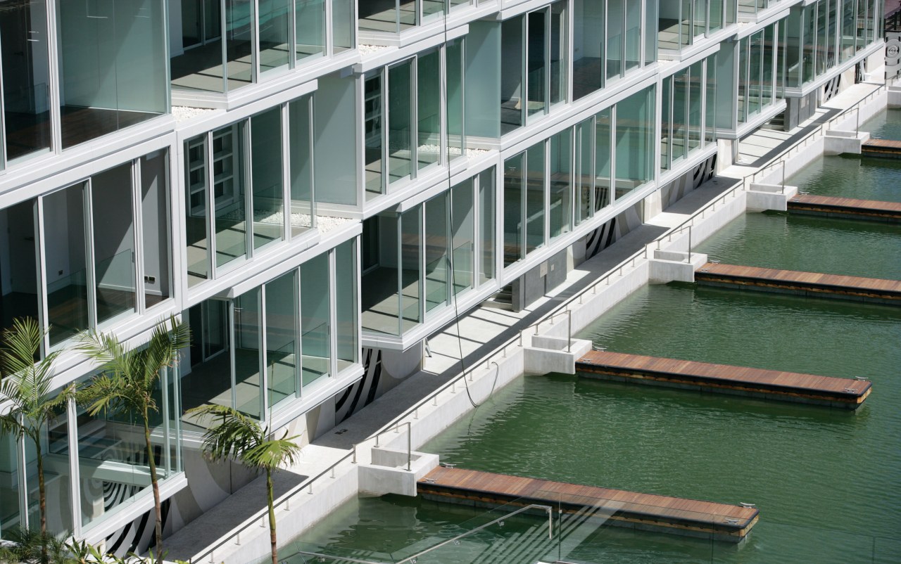 An exterior view of the lighter quay apartment architecture, building, condominium, facade, mixed use, water, gray