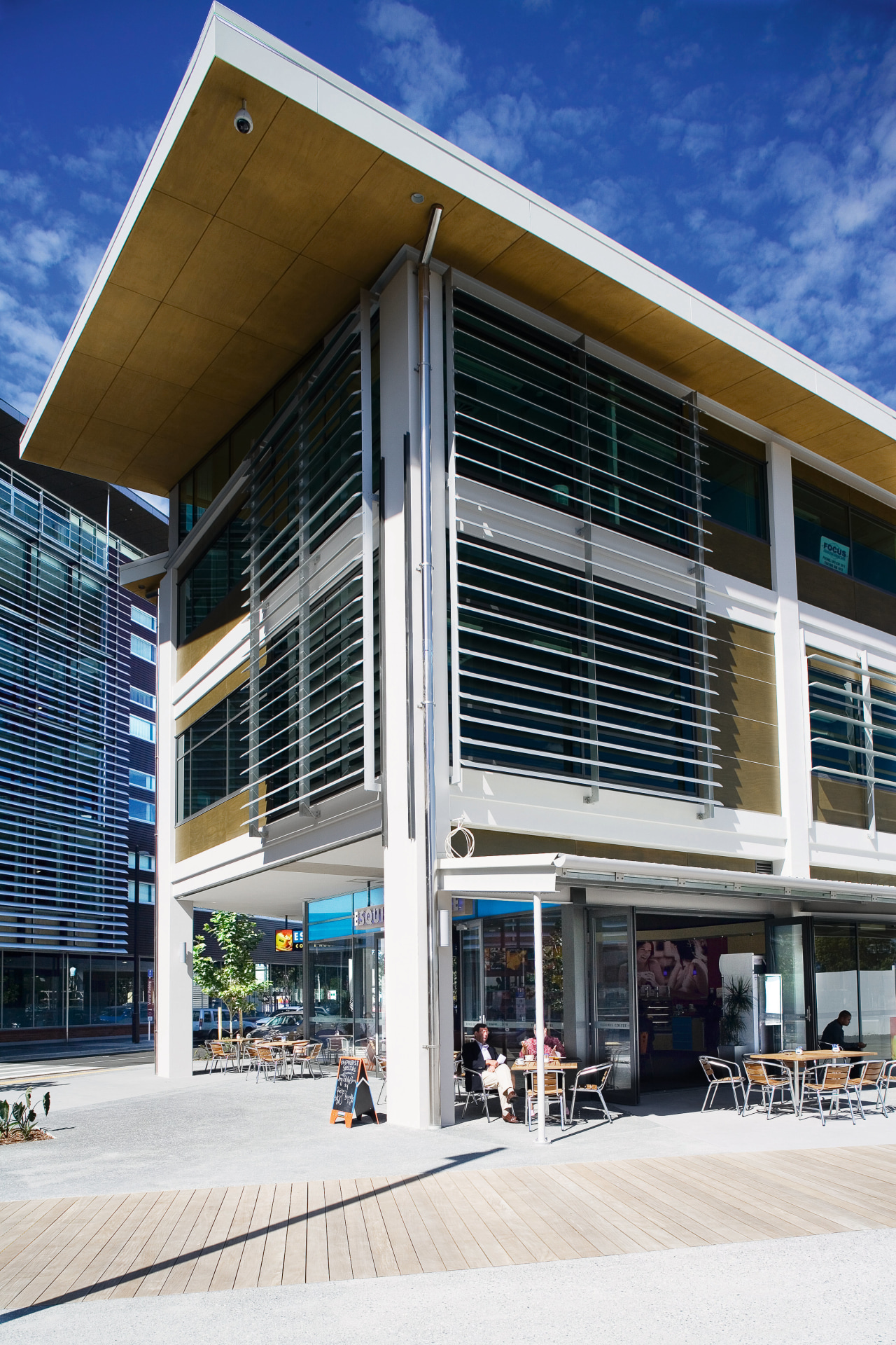 A view of extensive use of elliptical louvres architecture, building, commercial building, corporate headquarters, facade, mixed use, real estate, window, white