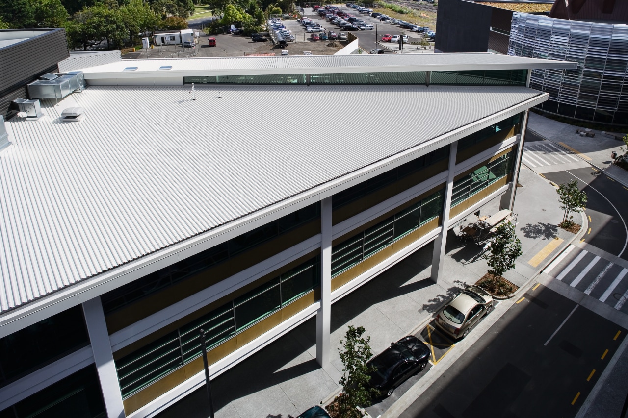 An exterior view of this building featuring metal architecture, building, daylighting, roof, structure, black, white