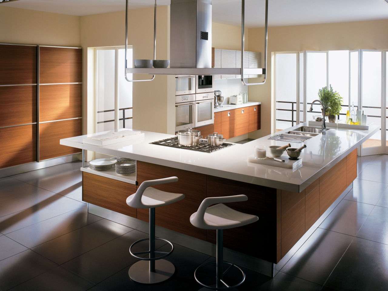 A view of this kitchen featuring teak cabinetry, cabinetry, countertop, cuisine classique, interior design, kitchen, gray