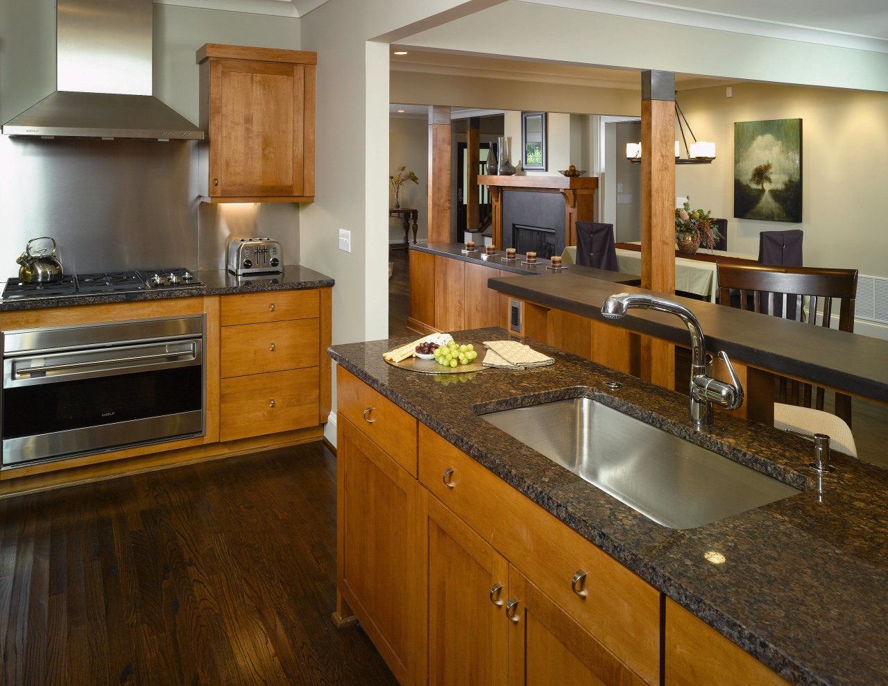 A view of this kitchen featuring stained timber cabinetry, countertop, cuisine classique, flooring, hardwood, interior design, kitchen, room, brown