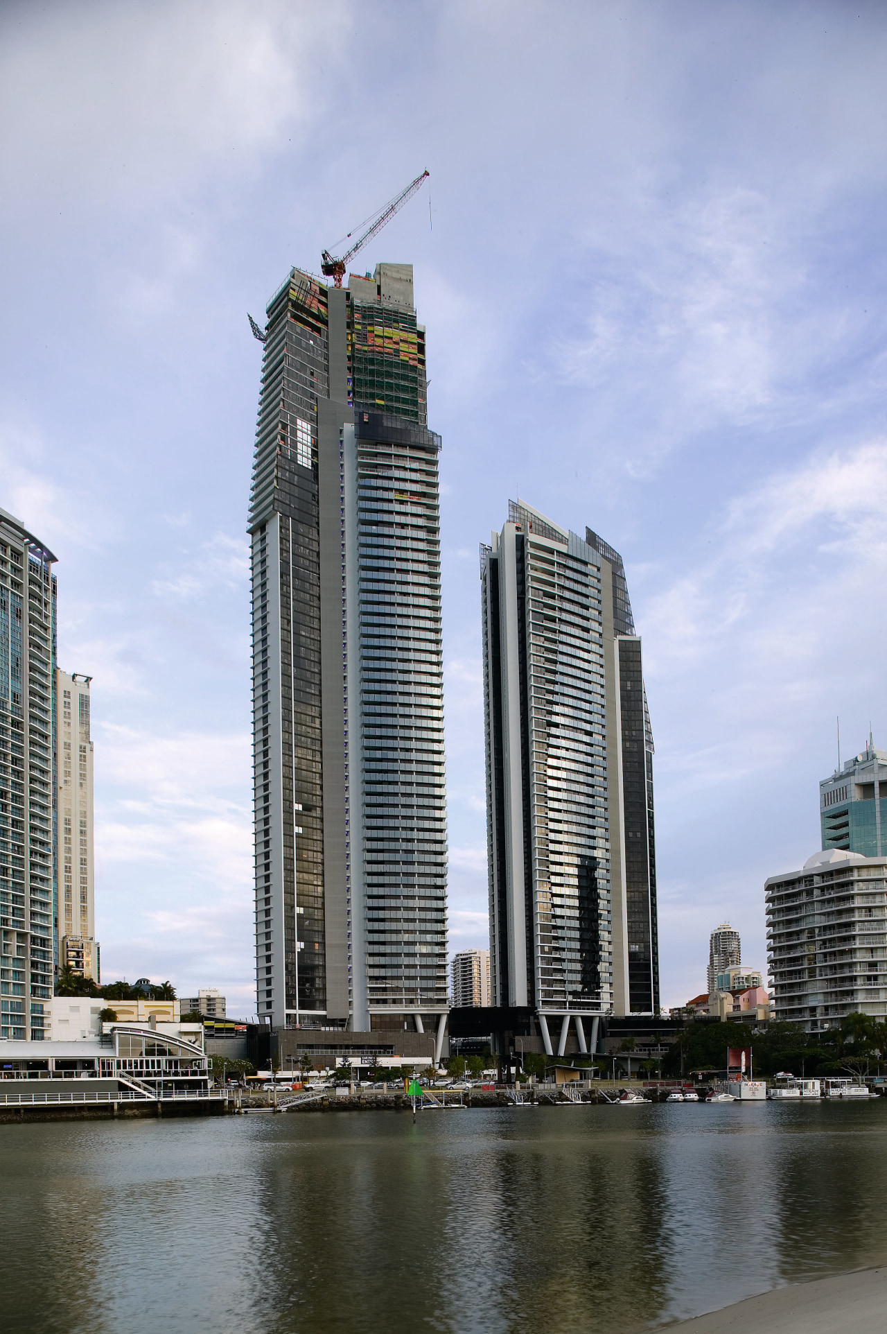Exterior view of the circle on Cavill apartment architecture, building, city, cityscape, condominium, daytime, downtown, metropolis, metropolitan area, reflection, sky, skyline, skyscraper, tower, tower block, urban area, water, teal