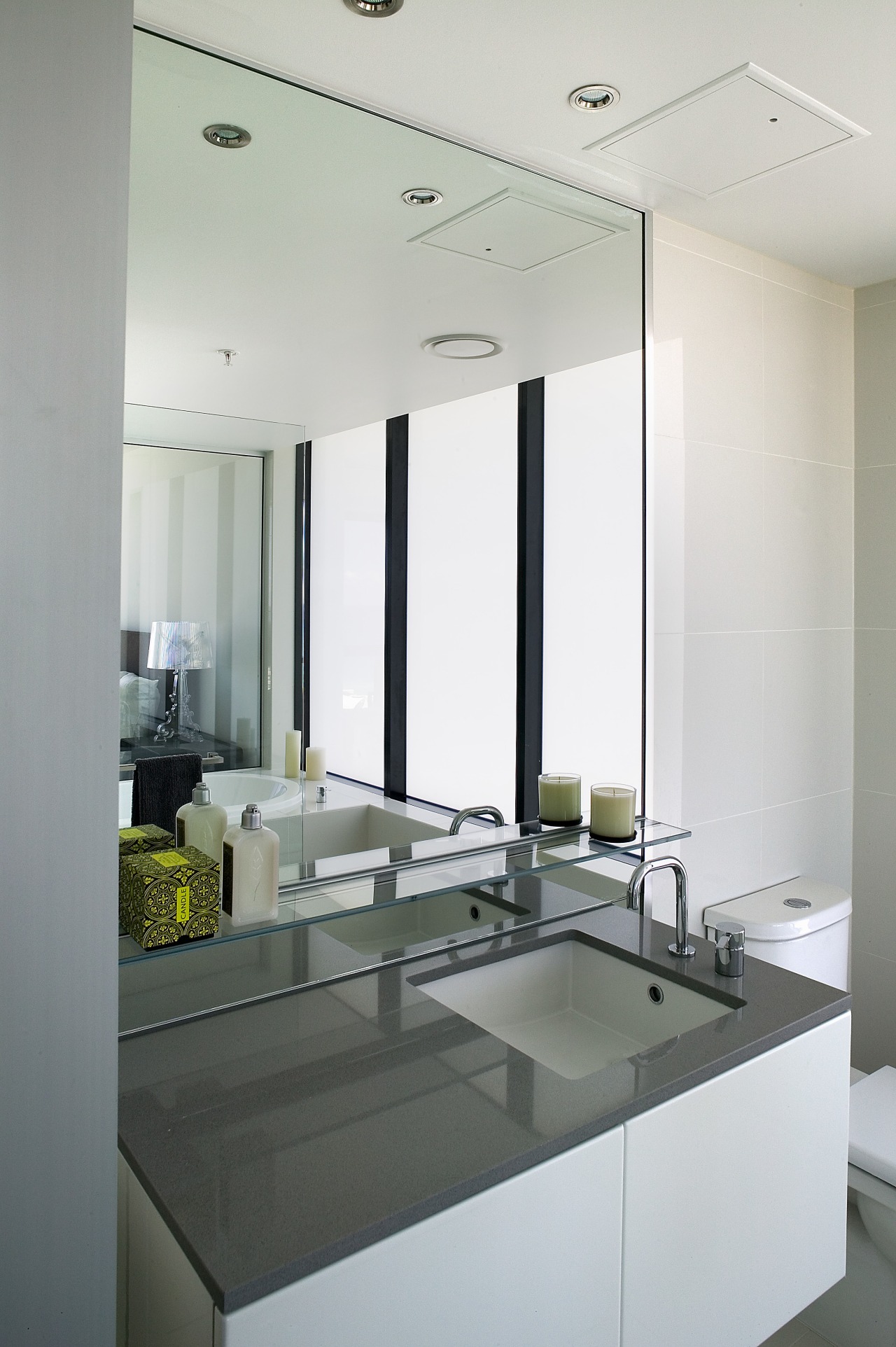 A view of the bathroom featuring  frameless architecture, bathroom, ceiling, glass, interior design, product design, sink, gray