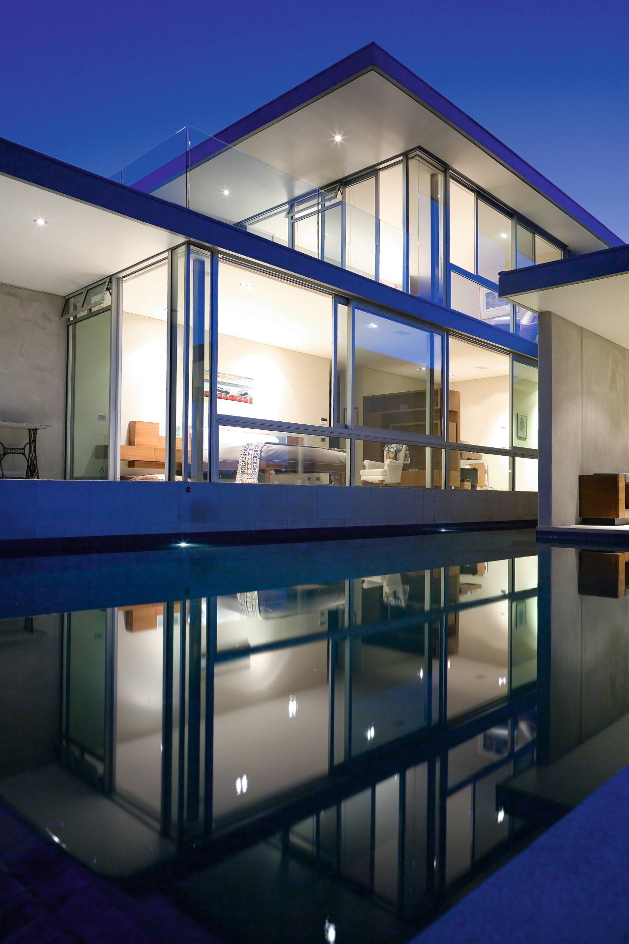 An exterior view of the home. apartment, architecture, condominium, daylighting, facade, home, house, interior design, property, real estate, window, blue