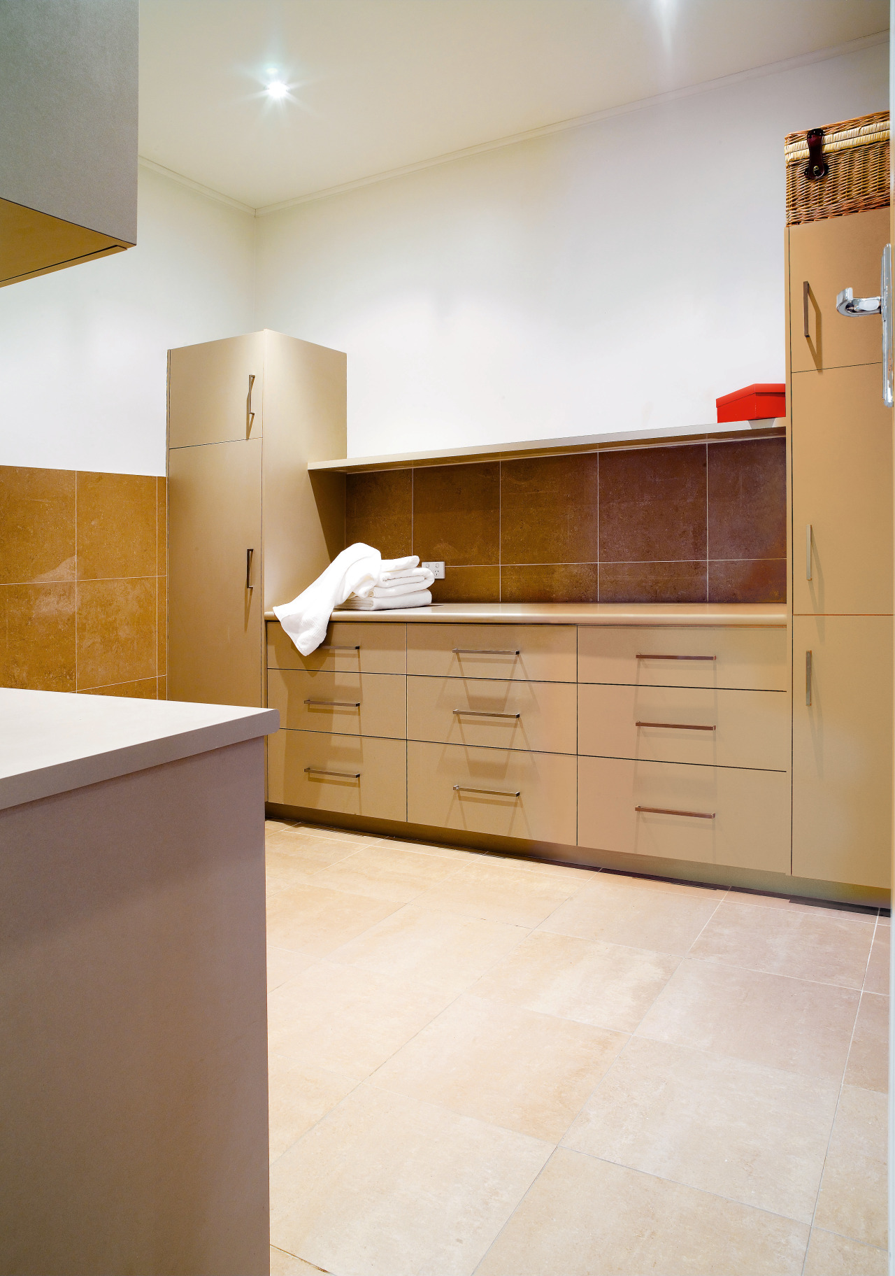View of laundry featuring cabinetry from Splendor Kitchens. cabinetry, countertop, cuisine classique, floor, flooring, hardwood, interior design, kitchen, laminate flooring, plywood, property, real estate, room, tile, wood, wood flooring, white