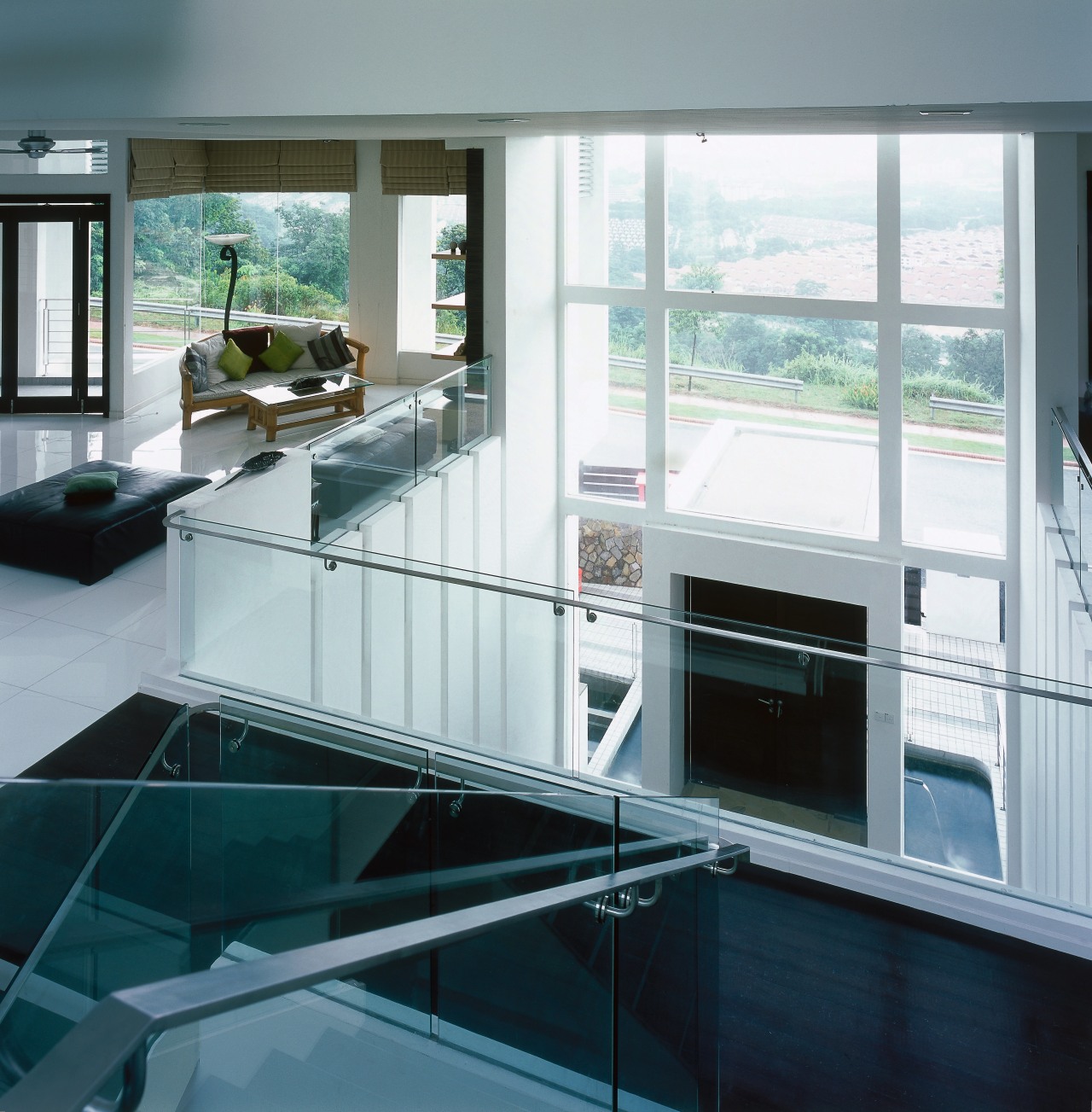 A view of the formal double height foyer, architecture, countertop, daylighting, glass, interior design, kitchen, window, gray