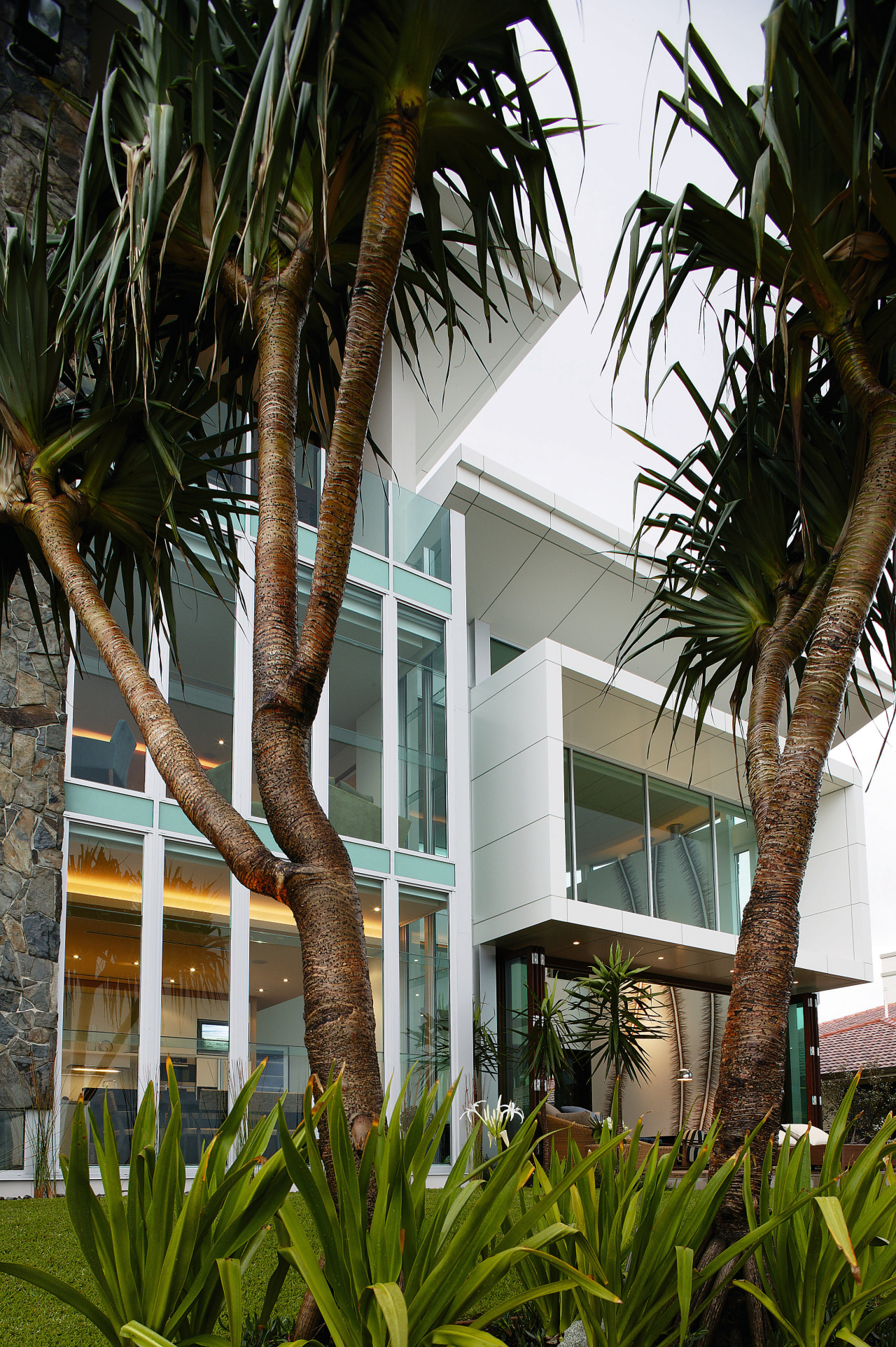 Exterior view of the solid masonry beachfront house arecales, home, house, palm tree, plant, property, real estate, resort, tree, window, brown, black