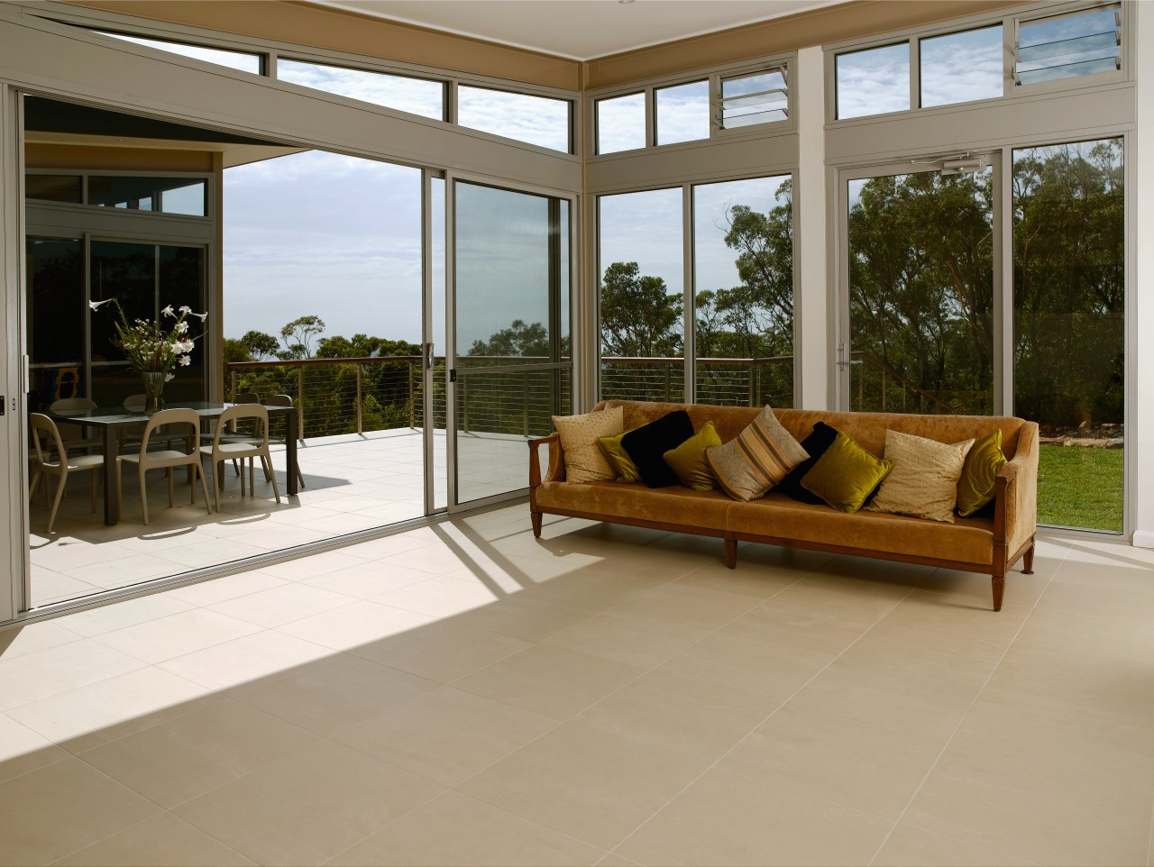 A view of some floor tiles from Impresa door, estate, floor, flooring, hardwood, house, interior design, living room, property, real estate, window, wood flooring, brown, gray