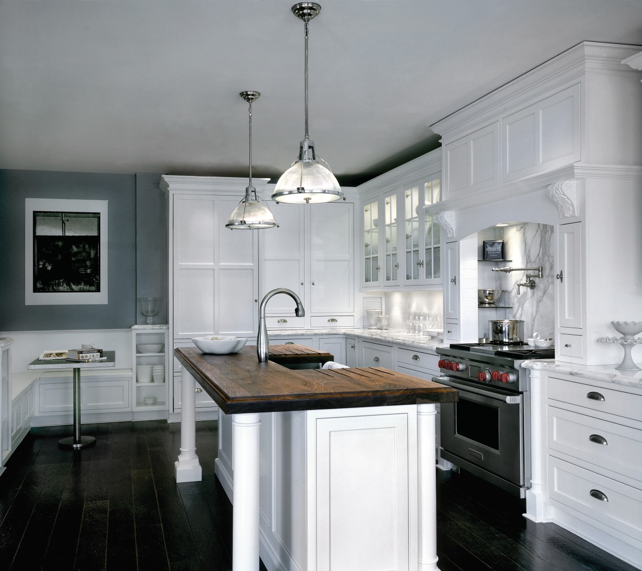 A view of this white kitchen featuring traditional cabinetry, countertop, cuisine classique, home appliance, interior design, kitchen, gray