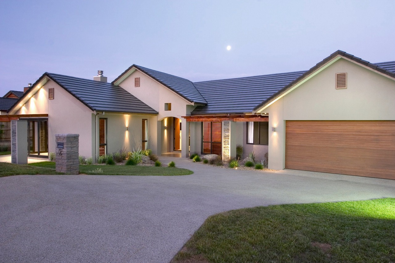 A view of a home designed and built cottage, elevation, estate, facade, farmhouse, home, house, property, real estate, residential area, roof, siding, window, gray, teal