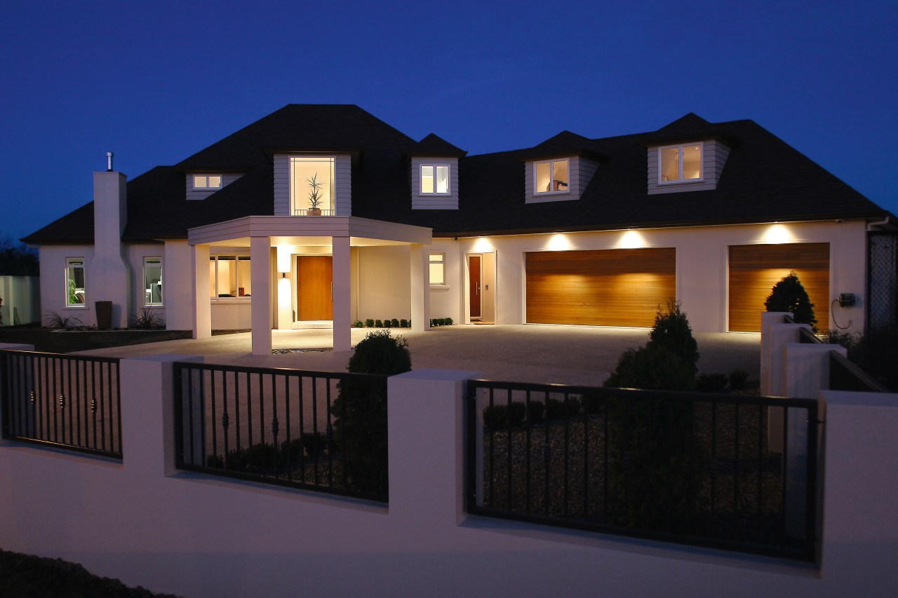 A view of this home hiding the facade architecture, building, elevation, estate, facade, home, house, lighting, property, real estate, residential area, window, black, blue