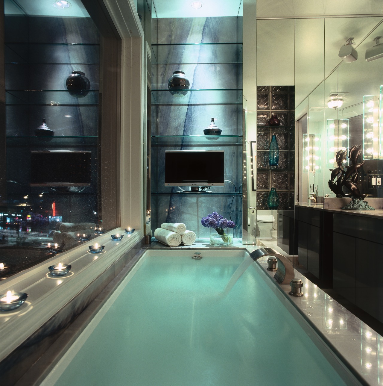 A close up of the bath tub in bathroom, countertop, glass, interior design, black