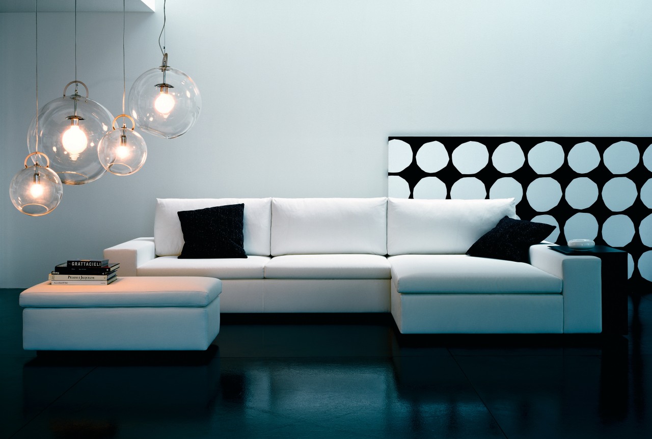 A view of the italian style lounge furniture angle, couch, furniture, interior design, light fixture, lighting, living room, product design, room, sofa bed, table, wall, white, black