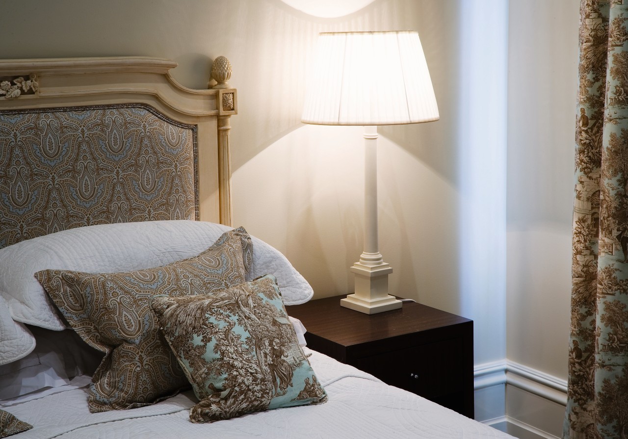 A view of this bedroom featuring carpet flooring, bed, bed frame, bedroom, ceiling, curtain, floor, furniture, home, interior design, room, suite, textile, wall, window, window covering, window treatment, wood, gray