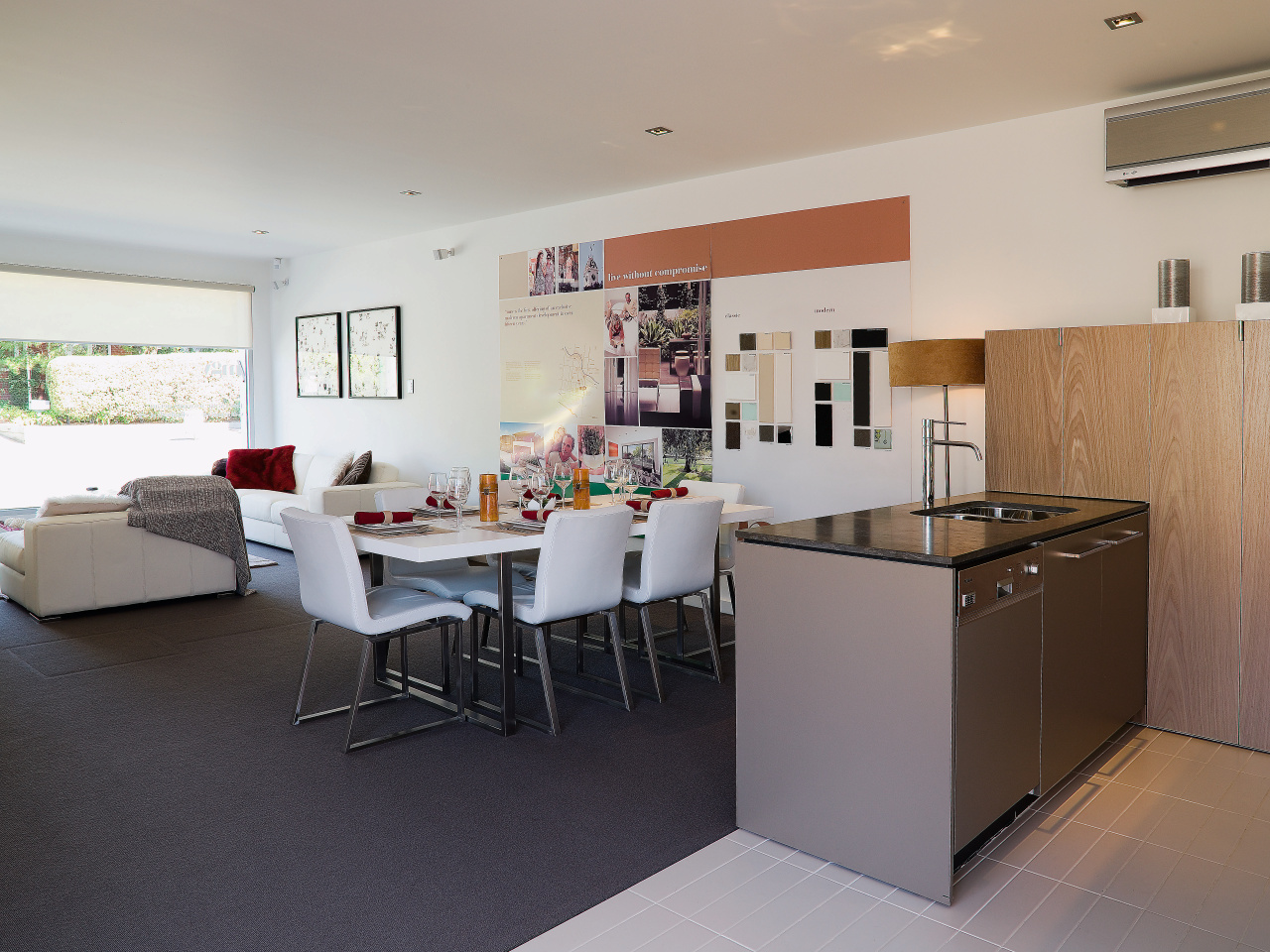 A view of this kitchen featuring tiled flooring, architecture, floor, flooring, house, interior design, kitchen, living room, real estate, room, table, gray