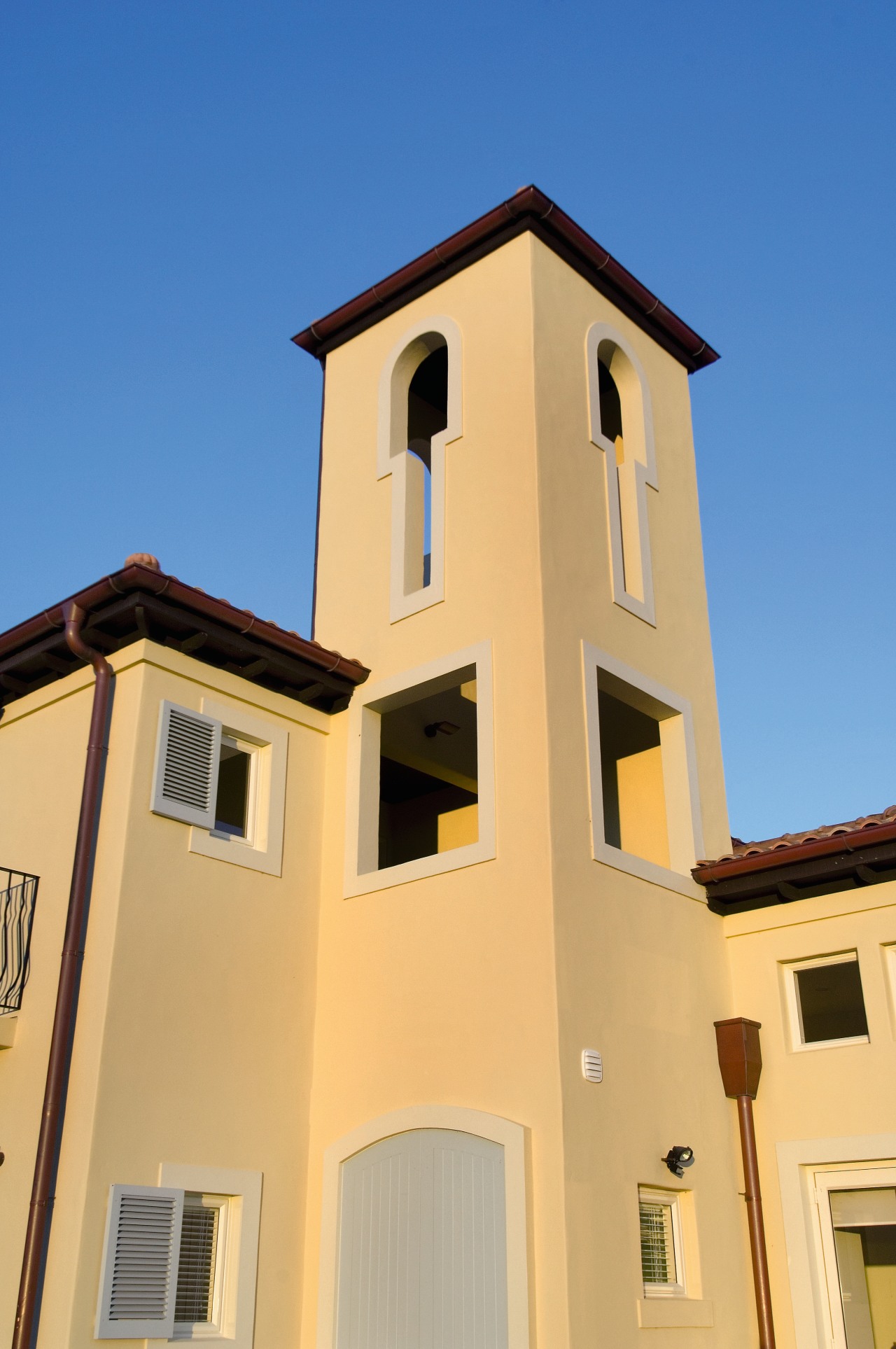 A view of a home built by Nautica apartment, architecture, building, facade, home, house, property, real estate, roof, sky, window, orange, blue