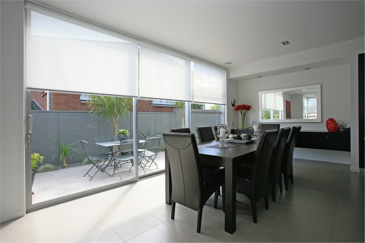 A view of these living areas featuring stained dining room, interior design, property, real estate, room, table, window, gray, white