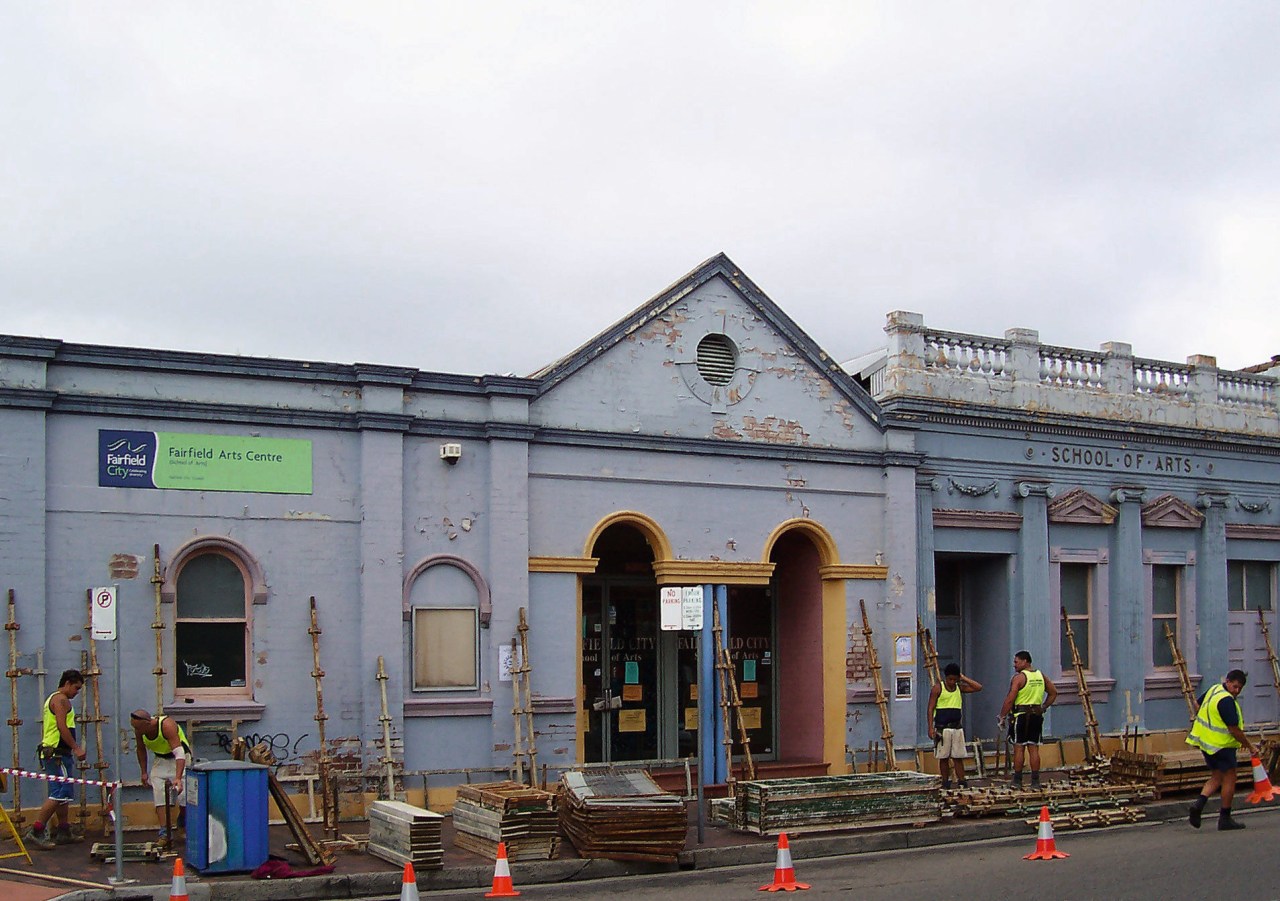 A view of an exterior restoration carried out building, transport, vehicle, white, gray