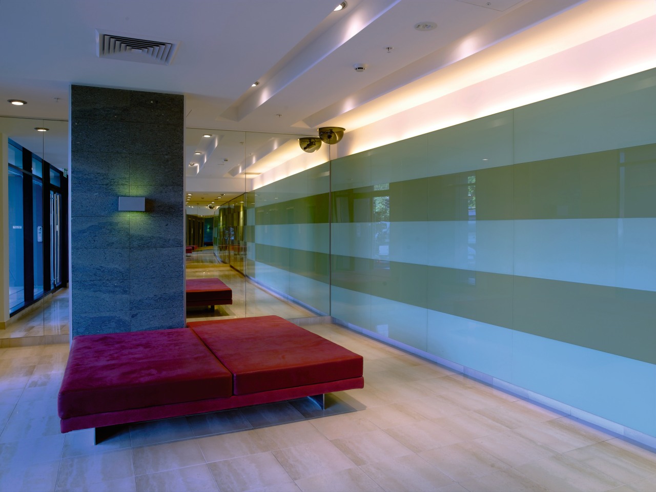 Interior veiw of the Lobby featuring laminate flooring, architecture, ceiling, daylighting, floor, flooring, glass, hardwood, house, interior design, lighting, lobby, real estate, room, wall, wood, wood flooring, gray