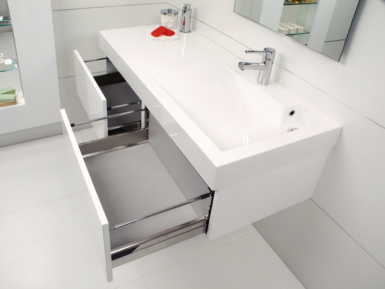 View of this bathroom featuring white cabinetry, stainless angle, bathroom, bathroom accessory, bathroom cabinet, bathroom sink, drawer, furniture, plumbing fixture, product design, sink, tap, white, gray