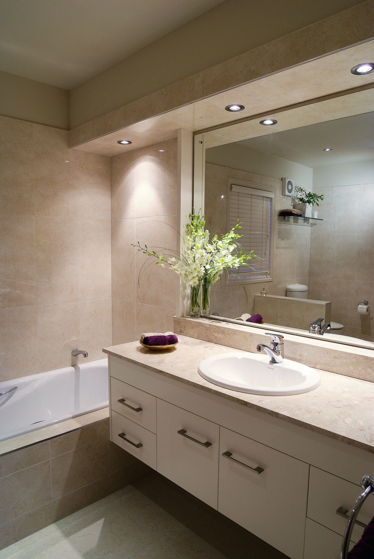 A view of a bathroom by Bathrom Direct. bathroom, bathroom accessory, bathroom cabinet, cabinetry, countertop, home, interior design, room, sink, brown, gray