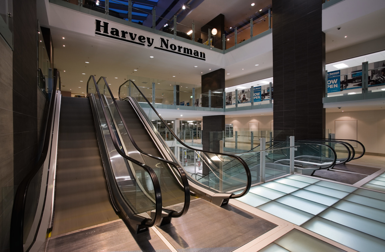 A view of an esculator within the Harvey escalator, shopping mall, structure, black, gray