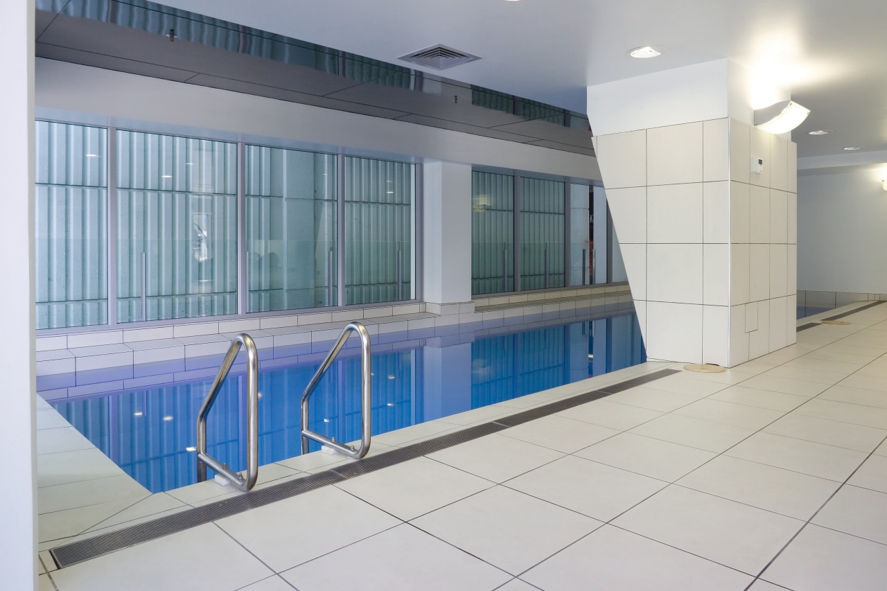 A view of the Precinct Apartments constructed by daylighting, glass, leisure centre, property, real estate, window, gray