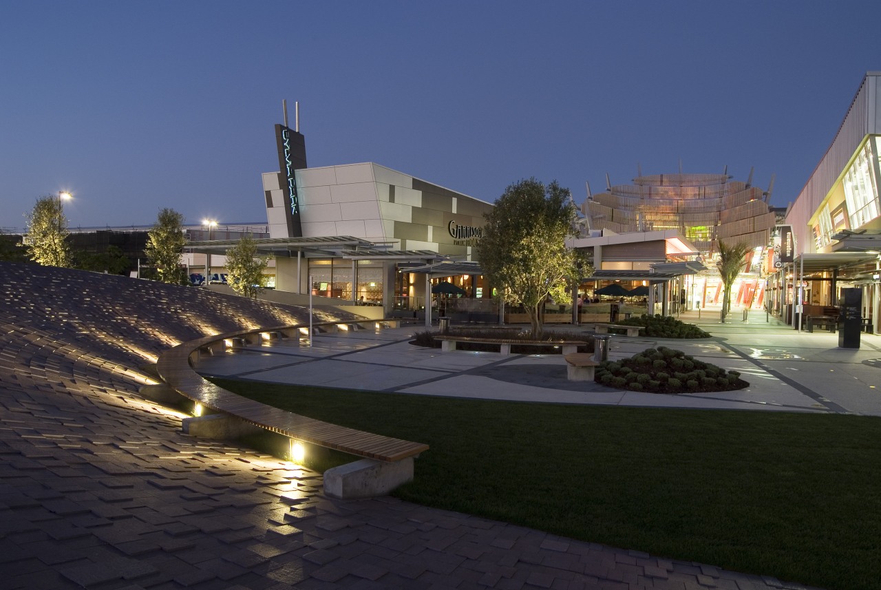 A view of Sylvia Park. architecture, city, estate, evening, lighting, mixed use, night, plaza, real estate, reflection, residential area, sky, town square, black, blue