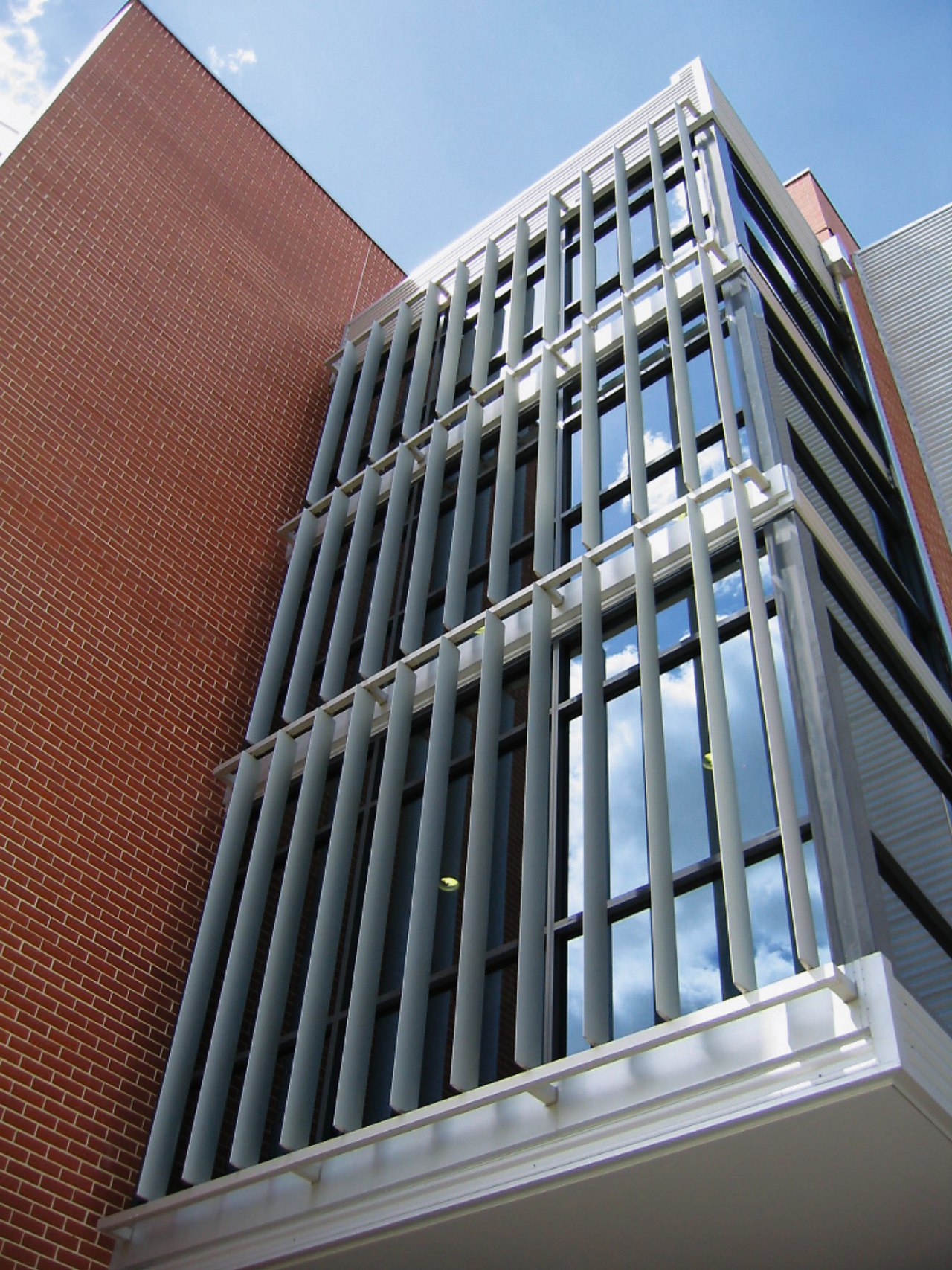 A view of the louvres/sunshades installed on the architecture, brutalist architecture, building, classical architecture, commercial building, condominium, corporate headquarters, daylighting, daytime, facade, headquarters, landmark, line, metropolis, metropolitan area, skyscraper, structure, tower block, window, gray