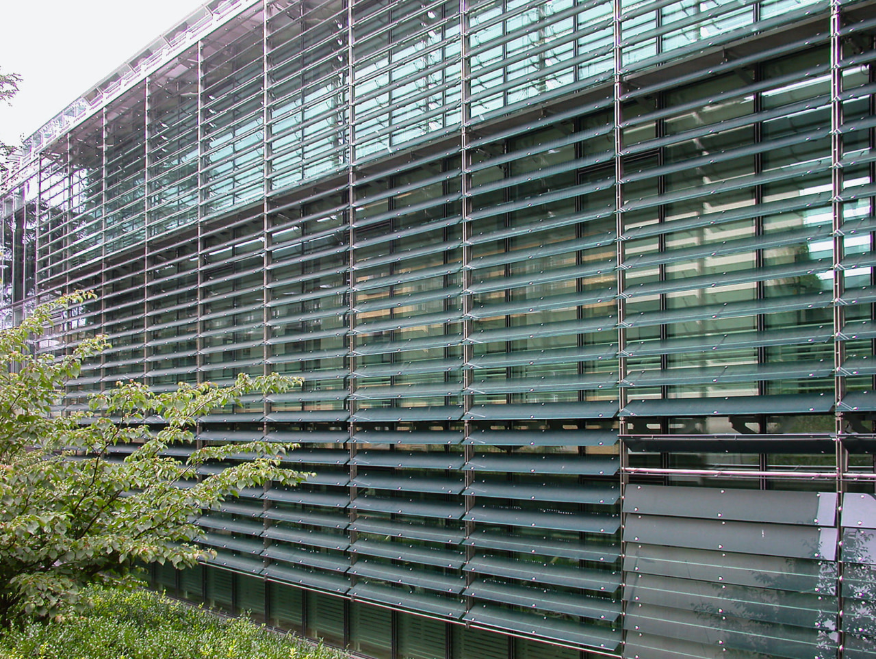 A view of the louvres/sunshades installed on the architecture, building, condominium, facade, fence, window, gray