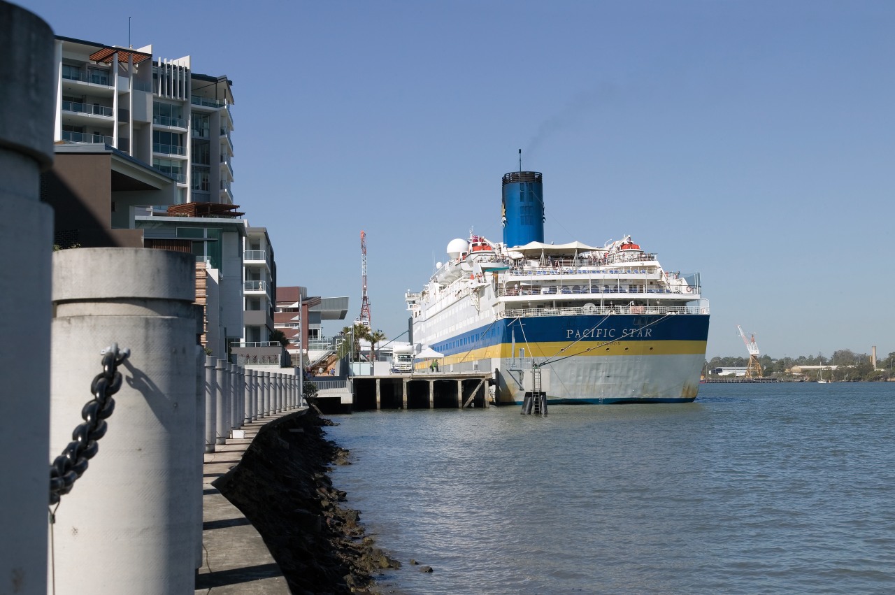 A view of the Portside Wharf  Waterway channel, cruise ship, ferry, motor ship, ocean liner, passenger ship, ship, water transportation, watercraft, waterway, teal, gray
